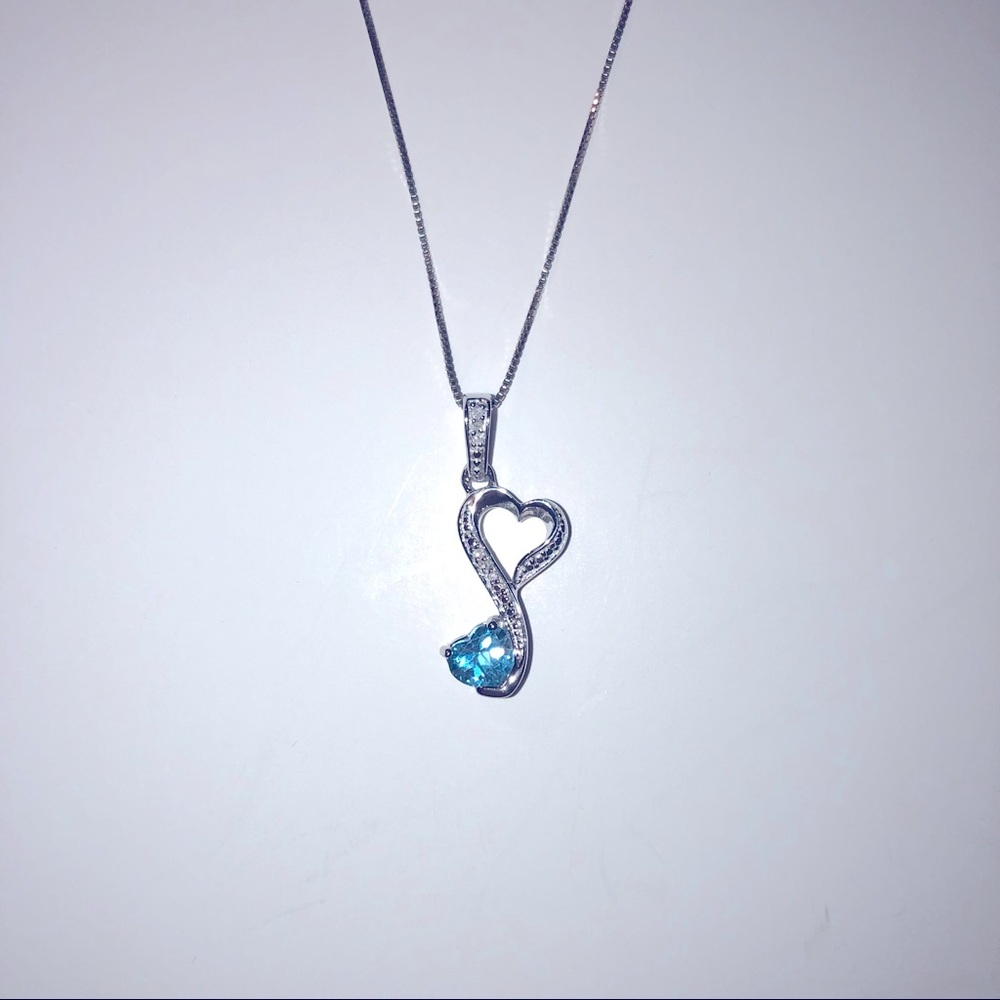 Sterling silver blue topaz heart pendant on chain